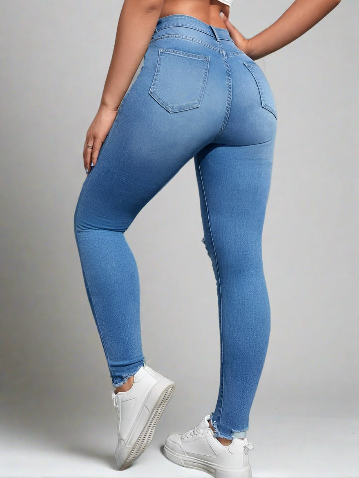 Compra de jeans skinny con lavado claro y rodillas rasgadas