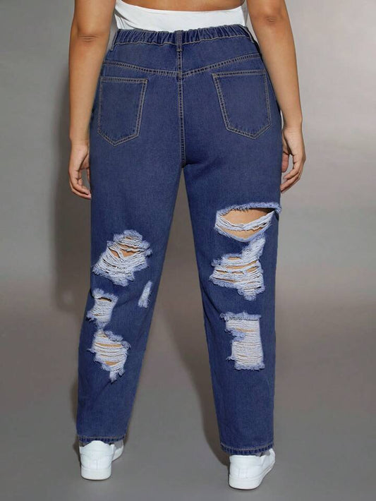 Mujer luciendo Jeans Azules Oscuro Rotos de Tallas Extras PDMX, perfectos para cualquier ocasión.
