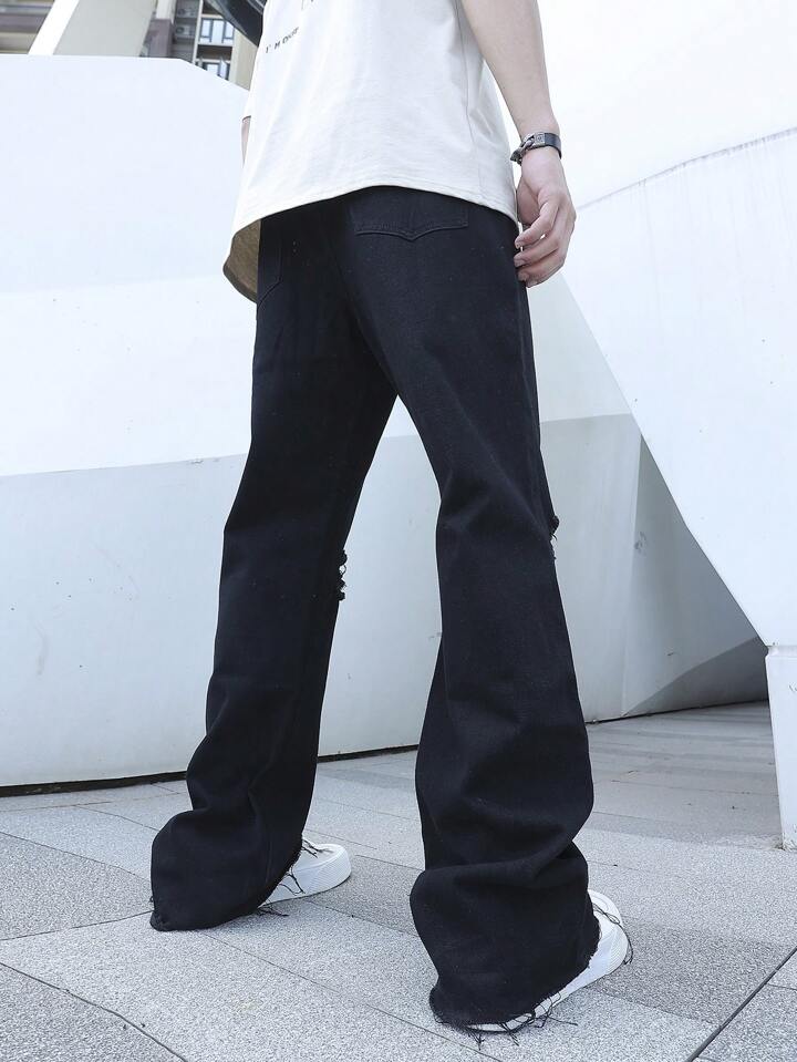 Moda PDMX: Jeans Acampanados Negros Rotos para Look Casual