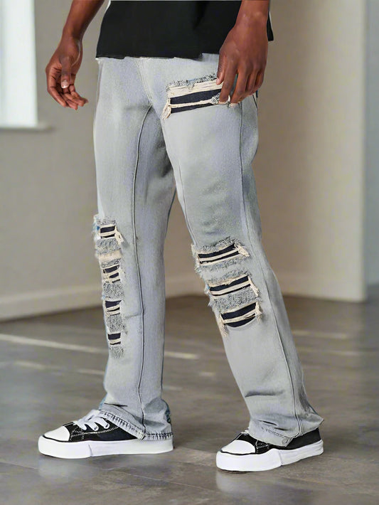 Moda masculina: jeans campana grises con roturas y corte moderno