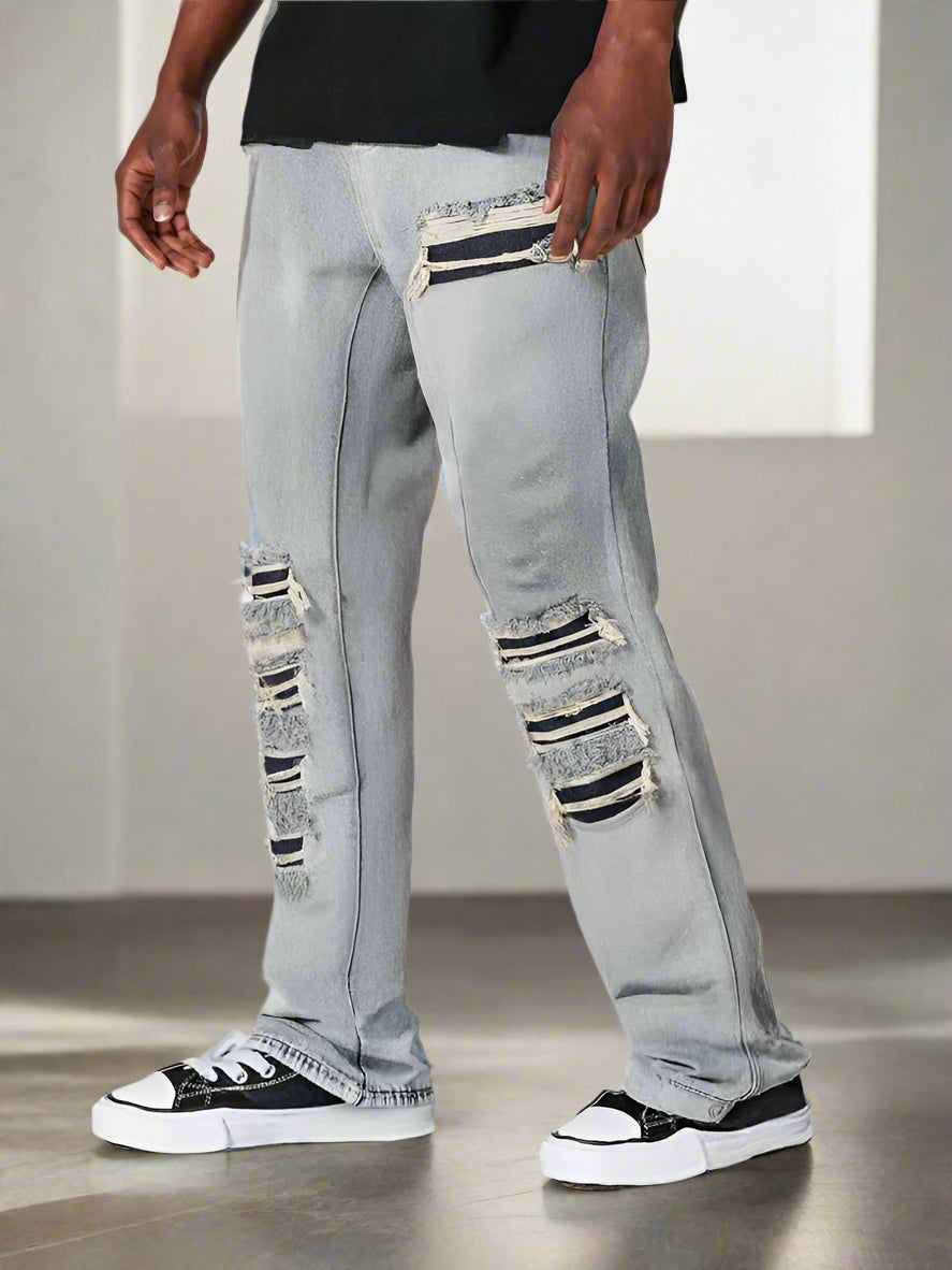 Jeans grises rotos de campana para hombre con estilo urbano